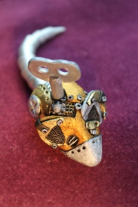 Polymer clay, steampunk-inspired clockwork mouse.